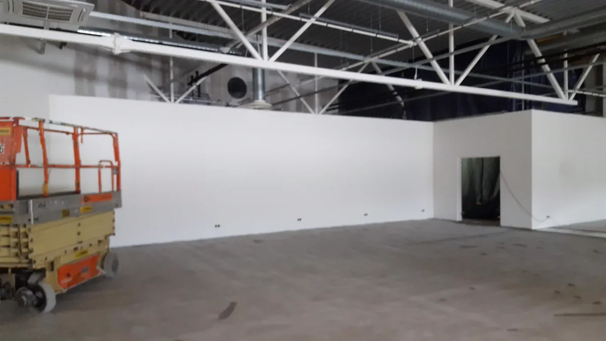 Freshly rolled interior partition wall inside an Ottawa commercial unit