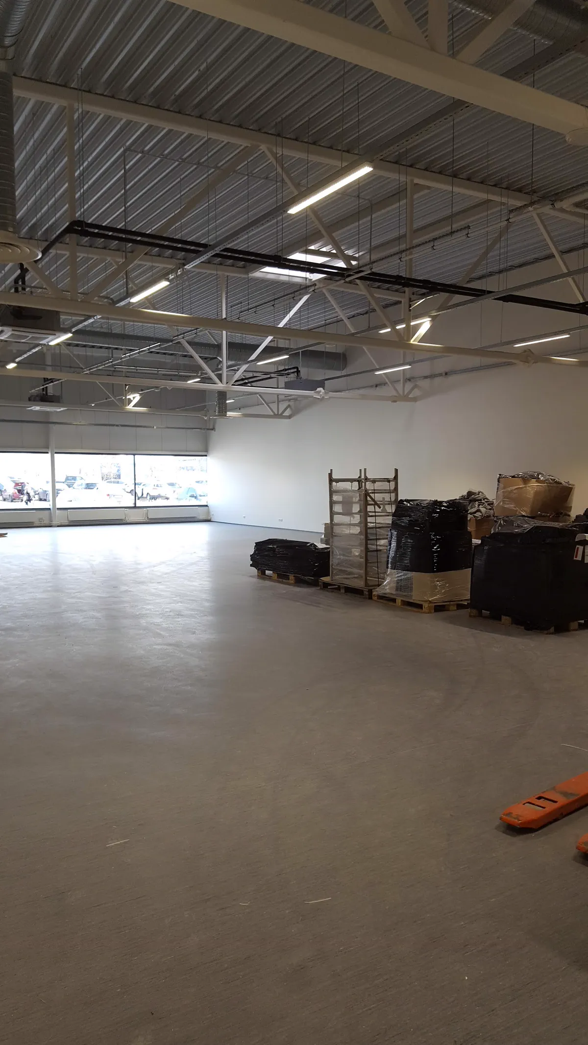 Repainted interior of an Ottawa retail unit with a finished feature wall